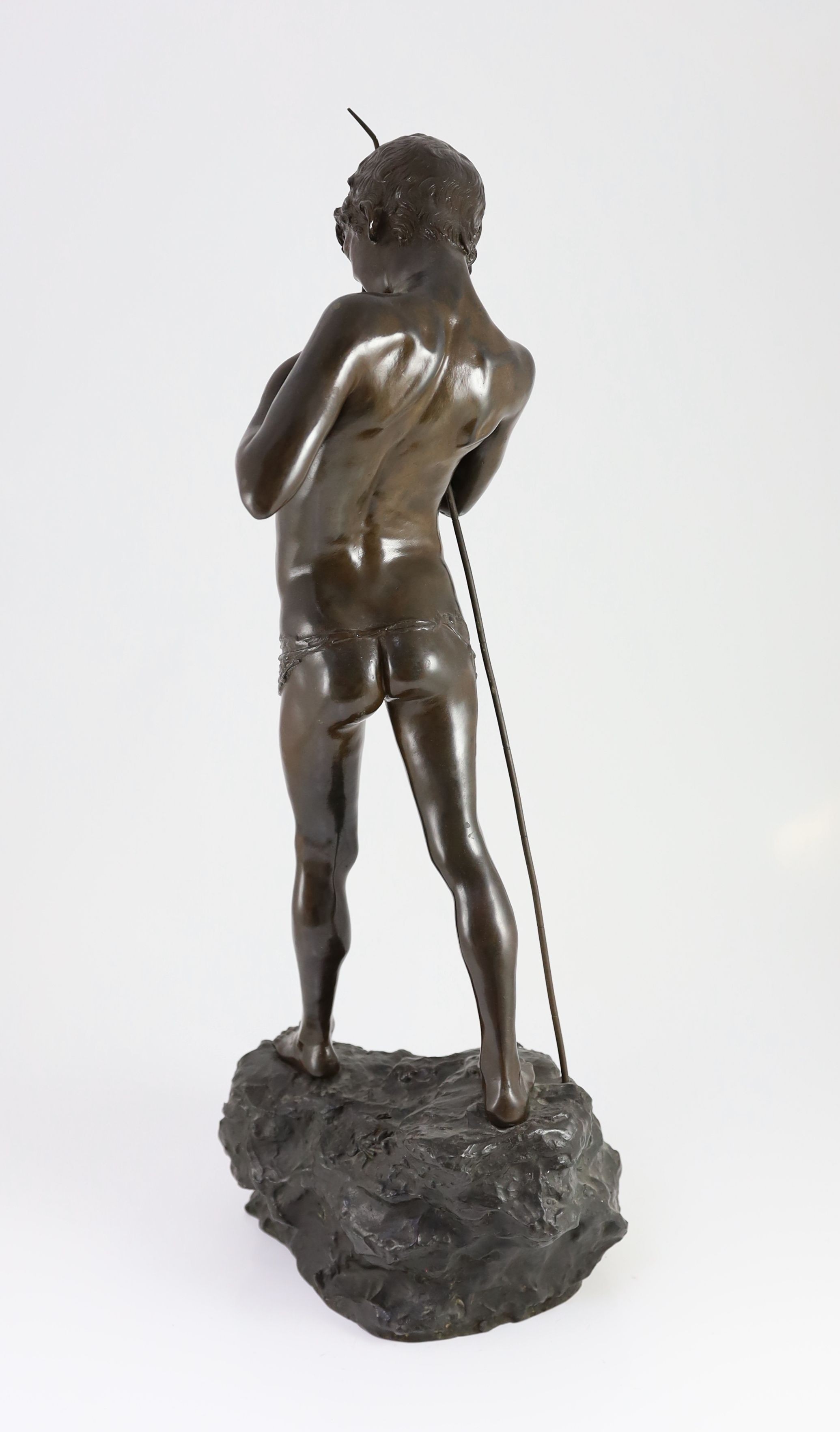 Giovanni Varlese (Italian, 1888-1922). A bronze figure of a fisherboy standing holding a fish to his chest, height 72cm